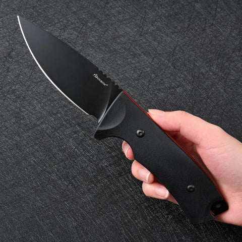 Hand holding VG10 Steel Fixed Blade Tactical Knife With Ergonomic Micarta Handle And Kydex Sheath on a textured surface