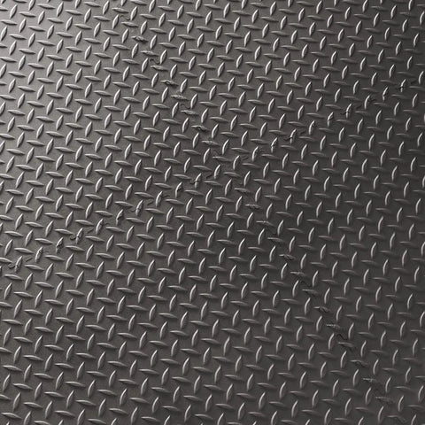 Close-up of the diamond plate surface of Interlocking Rubber Floor Tiles 18x18 Inch Diamond Plate Squares That Are Tough-As-Nails For Home Gym Garage.