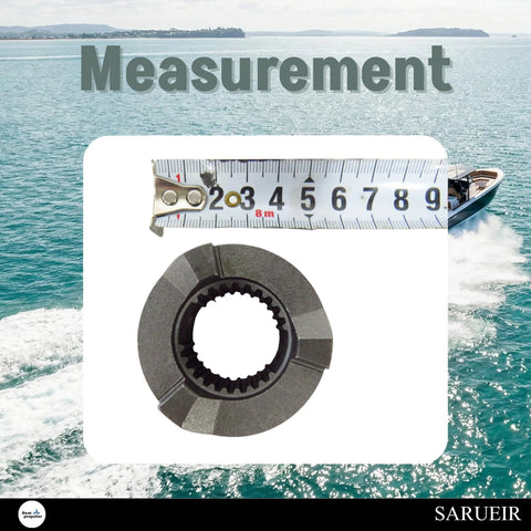 Clutch dog replacement for Yamaha outboard motors; metal with inner spline bore, close-up with measuring tape for scale.