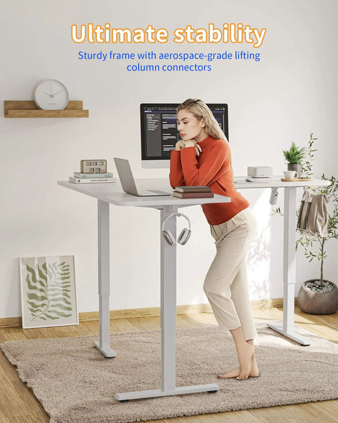 Spacious YIHAYO L Shaped Standing Desk Adjustable Height Electric Corner Computer Desk, white frame, sturdy, ergonomic use.