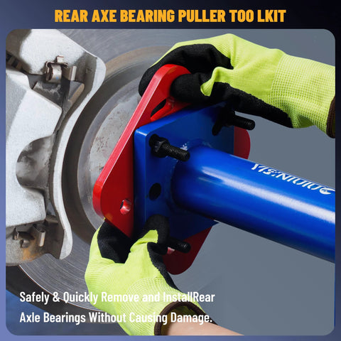 Individual using rear axle bearing puller and installer with ABS tone ring tool adapter plate on Toyota truck for axle service.