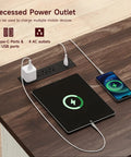 Recessed power outlet on a walnut finish tabletop with charging ports for devices at 55 Inch Electric Standing Desk Farmhouse Style Sit Stand Workstation Featuring Smooth Silent Motors Roll Out File Cabinet And Expanded Wood Surface Home Office Flex Boss Ready Daily Grind Setup.