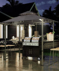 8 By 5 Foot Outdoor Grill Gazebo With Double Tier Canopy And LED Light, BBQ Party Shelter For Backyard Cookin, Rustproof Steel Frame, Patio Shade, Gray in nighttime setting with grill underneath.