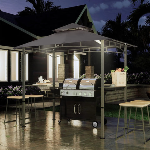 8 By 5 Foot Outdoor Grill Gazebo With Double Tier Canopy And LED Light, BBQ Party Shelter For Backyard Cookin, Rustproof Steel Frame, Patio Shade, Gray in nighttime setting with grill underneath.