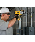 Man using Corded Hammer Drill Kit With Half Inch Capacity And Ten Amp Power For Masonry Wood And Steel Drilling Dual Mode Hammer And Drill Built For Pros And Serious DIYers Who Need Beefy Power on concrete wall