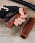 Cyclist holding soft cushioned 127mm vinyl MTB grips for mountain bikes and beach cruisers beefy comfort grips.