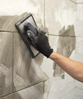 Applying tile grout with Molded Rubber Grout Float With Non Stick Gum Rubber Pad 4 In By 9.5 In Aluminum Back Plate Beveled Sides