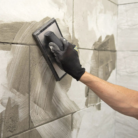 Applying tile grout with Molded Rubber Grout Float With Non Stick Gum Rubber Pad 4 In By 9.5 In Aluminum Back Plate Beveled Sides