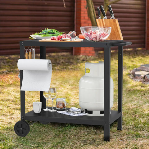 32x20IN Double Shelves Grill Table Movable Outdoor Grill Cart For Griddle And Pizza Oven Patio Kitchen Prep Table For Parties BBQs And Outdoor Cooking Durable Weatherproof Metal Stand With Easy Cleanup showing in garden setting with knives, propane tank, and ingredients on top.