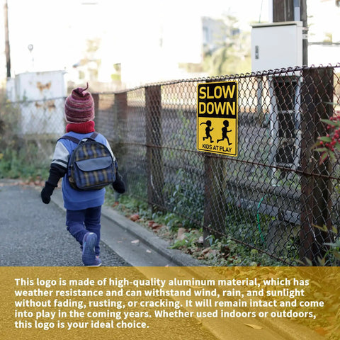 Installed 'Slow Down Kids At Play Road Sign For Neighborhoods, Aluminum Weatherproof Safety Plaque, Rust Free Durable Metal, Waterproof Indoor Outdoor, Easy To Mount, 12 By 8 Inches, High Visibility' on fence with child in view.