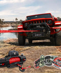 Synthetic Winch Rope Kit Half Inch By Eighty Five Feet With Thirty Two Thousand Pound Tensile Strength Made From UHMWPE For Off Road Four By Four Vehicles Includes Protective Sleeve Forged Hook And Safety Strap Red shown on red SUV