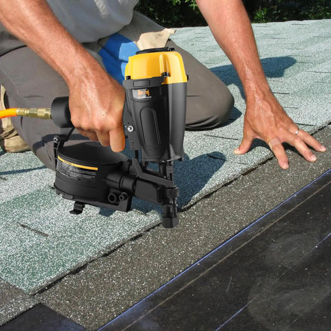 Worker using Coil Roofing Nailer 11 Gauge With Magnesium Housing Drives 7/8 To 1 3/4 Inch Full Head Nails on shingles