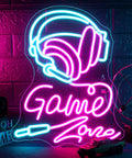 Neon sign with headphones and 'Game Zone' text on a brick wall, featuring pink and blue LED lights, gaming-themed decor.