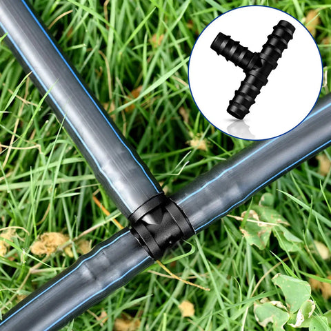 All In One 32 Piece Drip Irrigation Fittings Kit For Three Quarter Inch Tubing With Tees Elbows Couplings And End Cap Plugs Barbed Connectors For Garden Lawn Flower Pots No Fuss Install showing tee connector on grass