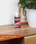 Diversion Safe Stash Can 11oz Travel Size with hidden compartment among home decor on wooden shelf.