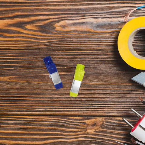 Essential 50 Piece Metal Spring Clamps Set For Woodworking And Crafting on wood grain with colorful clamps