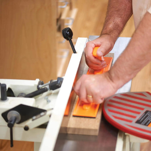 Using Must Have Power Tool Safety Set For Woodworking With Foam Grip Push Blocks on table saw for precise control and safety.