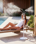 Standing Misting System With Fillable Base by poolside, adjustable height, 26.2ft water line, providing patio cooling, white.