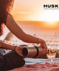 Woman using Next Gen Iceless Wine Chiller Keeps Your Bottle Cold Up To 6 Hours No Ice Needed Fits Champagne Bottles All Stainless Steel