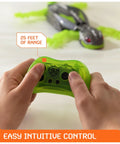Person using remote control for Wall Crawling Gecko Robot With Remote Control Realistic Creepy Crawly Action That Climbs Walls Rechargeable Toy For Kids Ages Four And Up Prank Ready Indoor Climber A Fun Interactive Toy For Boys And Girls with 25 feet range.