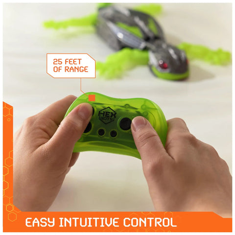 Person using remote control for Wall Crawling Gecko Robot With Remote Control Realistic Creepy Crawly Action That Climbs Walls Rechargeable Toy For Kids Ages Four And Up Prank Ready Indoor Climber A Fun Interactive Toy For Boys And Girls with 25 feet range.