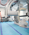 Aqua Shield Surface Protector 10 Mil 36 Inch By 100 Foot Heavy Duty Protective Film in use on surgical room floor under medical equipment