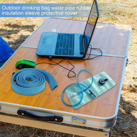 Insulated Water Bladder Tube Cover Keeps Hydration Cold Or Hot Must Have For Hiking And Camping, blue rubber sleeve on table.