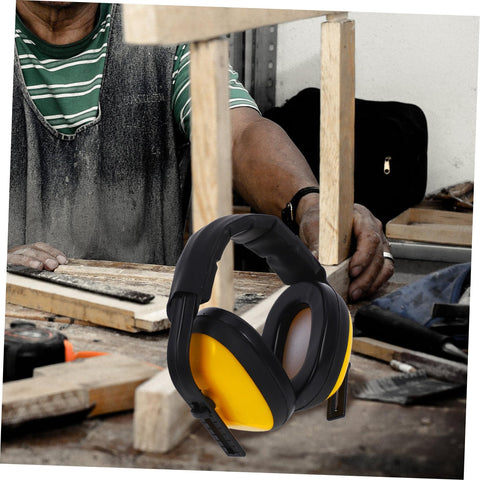 Lock Down Every Distraction Heavy Duty Noise Reduction Earmuffs on a workbench, featuring black and yellow design, perfect for industrial hearing protection.