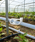Ten Pack Plastic Tubing Clamps with Adjustable Flow Control for Quarter To Half Inch Tubes, used in greenhouse setup