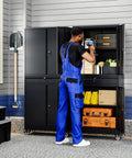 Heavy Duty Metal Garage Storage Cabinet With Locking Doors And Adjustable Shelves 73 Inch Rolling Tool Cabinet With Four Wheels And One Drawer For Garage And Warehouse Black. A person organizing tools inside the cabinet.