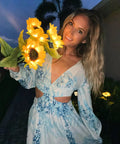 Woman holding Sunflower Garden Lights Six LED Outdoor Flowers With Solar Panels IP66 Waterproof Auto Charge