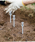 Durable Lawn Aerator Spike Shoes With Metal Pegs for Deep Soil Aeration being used in garden for lawn care