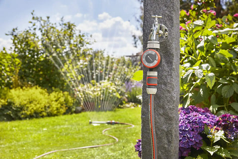Easy To Use Mechanical Water Timer With Flow Control For Sprinklers And Drip Irrigation on tap, watering a vibrant garden