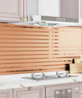 Ridiculously Sleek Rose Gold Metallic Peel And Stick Wall Panels Shimmer Stripe in modern kitchen backsplash design.