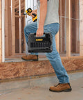 Man holding Impact Socket Set With Half Inch Drive Ten Piece Including Eight Common Sockets And Two Adapters For Quarter To Half Inch Built To Last High Impact Case With Pivoting Organization Pins for easy transport on construction site.