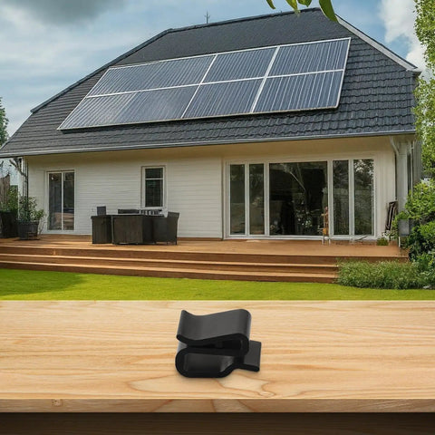 Rock Solid Solar Cable Clamps And Wire Clips For PV Panels on wooden surface with home solar installation in background.
