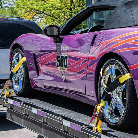 Sports car secured with Heavy Duty Car Tie Down Straps With Flat Hooks 10000 Lb Break Strength 4 Pack Tire Ratchet Straps For Trailers Trucks And UTVs 10Ft Lasso Straps Fit All Size Tires Smooth D Ring Hooks For Easy Mounts On Side Rails on a flatbed trailer.