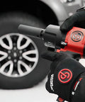 1/2 Inch Air Impact Wrench Packin 960 Ft Lbs Of Raw Torque for heavy-duty wheel removal close-up in use.