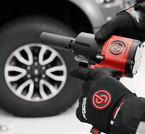 1/2 Inch Air Impact Wrench Packin 960 Ft Lbs Of Raw Torque for heavy-duty wheel removal close-up in use.
