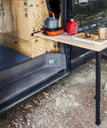 Game Changer Heavy Duty Telescoping Table Slider Leg With Slick Height Adjustments For RVS Campers Boats And Trailers Solid Aluminum Build supporting a camping table.