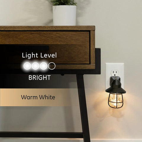 Vintage Style LED Night Light 4 Pack, Plug In Dusk To Dawn Sensor in black finish, illuminating a cozy farmhouse bedroom corner.