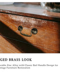 Antique Brass Cabinet Pulls Three And One Quarter Inch Center European Style Decorative Drawer Handles on wooden dresser