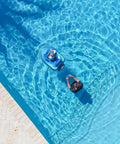 Remote Control Baby Pool Float With Enclosed Propeller Guard in water with child and adult controlling with remote