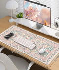 Pink Floral Desk Pad For Aesthetic Office Setup, XXL Large Mouse Pad With Non Slip Base And Stitched Edges on wooden desk