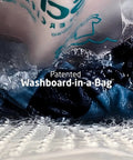 Pocket Sized Portable Travel Wash Bag Featuring Patented Washboard Design in use with bubbles on dark clothes.