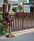Rustproof Cast Aluminum Locking Curbside Mailbox With Post Mount Large Black Beefy Heavy Duty Security Mailbox For Letters Magazines And Small Parcels Durable Weatherproof Design Built To Deter Fishing And Keep Mail Safe installed by a fence