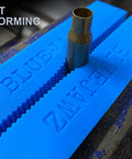 Heavy Duty Heat Resistant Magnetic Soft Jaws For Bench Vise Drill Press Clamps featuring blue rubber grips with a metal piece in a vise.