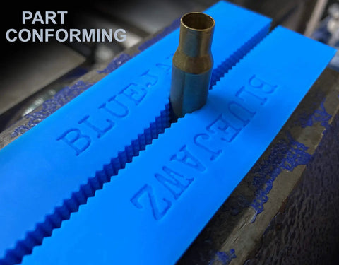 Heavy Duty Heat Resistant Magnetic Soft Jaws For Bench Vise Drill Press Clamps featuring blue rubber grips with a metal piece in a vise.