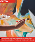 Person using Five Piece Paint Brush Set With Durable Synthetic Bristles For All Paint Types on a colorful mural