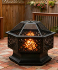 Hexagon 28 Inch Wood Burning Fire Pit with Spark Screen and Poker on patio, black steel construction for outdoor fun.
